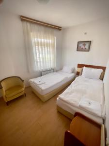 Voodi või voodid majutusasutuse Hotel Ilinden toas