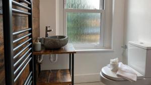 Ένα μπάνιο στο De Parys Serviced Flat in Bedford 4