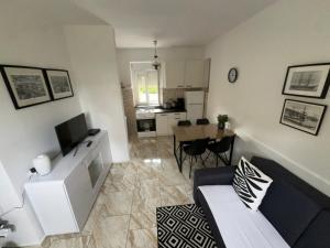 Uma TV ou centro de entretenimento em Apartment Marino