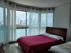 Postel nebo postele na pokoji v ubytování Live Stay - Torres del Lago + 53 fotografií