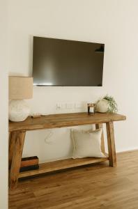TV a/nebo společenská místnost v ubytování Magnolia Cottage