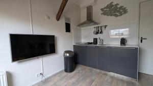 Kuchyň nebo kuchyňský kout v ubytování Ballumerhoeve Petit lodge