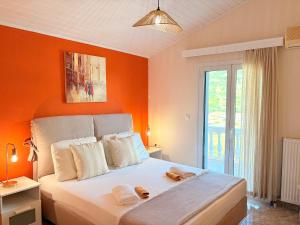 Ein Bett oder Betten in einem Zimmer der Unterkunft Myrtos Hotel