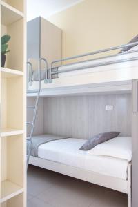 Postel nebo postele na pokoji v ubytování Jesolo Vista Lido Retreat + 19 fotografií