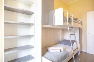 Postel nebo postele na pokoji v ubytování Jesolo Vista Lido Retreat