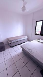 Ένα ή περισσότερα κρεβάτια σε δωμάτιο στο Apartamento Mongagua