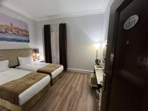 City Center Hotel Taksim İstanbul客房内的一张或多张床位