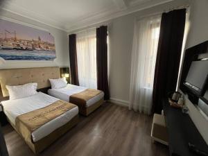 City Center Hotel Taksim İstanbul客房内的一张或多张床位