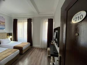City Center Hotel Taksim İstanbul客房内的一张或多张床位