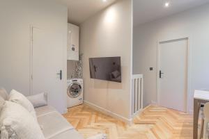 TV a/nebo společenská místnost v ubytování Appartement moderne et confortable , Ecully