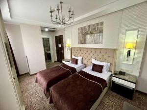 City Center Hotel Taksim İstanbul客房内的一张或多张床位