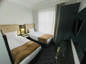 City Center Hotel Taksim İstanbul客房内的一张或多张床位