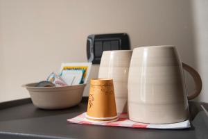 a group of cups sitting on top of a table at la dimora di Venere in Gaeta +31 photos