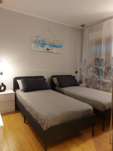 Ένα ή περισσότερα κρεβάτια σε δωμάτιο στο La Casina di Dudy