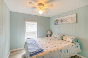 a bedroom with a bed and a ceiling fan at Boat and Fish Canal-Front Home on River in Okeechobee