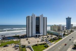 a view of the beach and buildings and a highway at 3br Condo With Direct Beach View & Large Balcony in Daytona Beach Shores