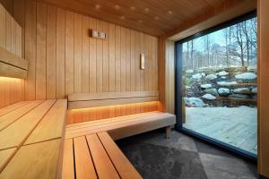 Postel nebo postele na pokoji v ubytování Hotel ELEMENTS Tatranska Lomnica + 28 fotografií