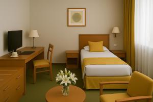 a hotel room with a bed and a desk at Resort Klewinowo in Klewinowo