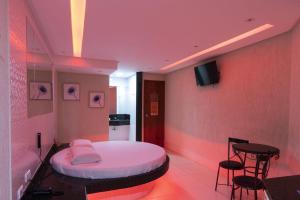 Et tv og/eller underholdning på Drops Motel Goiânia + 32 billeder