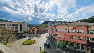 a view of a city with buildings on a street at Апартамент Димови in Tryavna