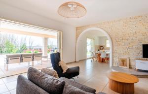 a living room with a couch and a table at Splendide Villa Avec Piscine in Saint-Cézaire-sur-Siagne