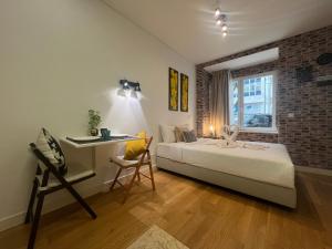 Ένα ή περισσότερα κρεβάτια σε δωμάτιο στο Morgan-Jupiter Apartments