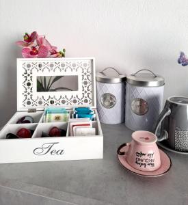 a table with a white box with food and a mirror at Summer House in SantʼAntìoco +15 photos