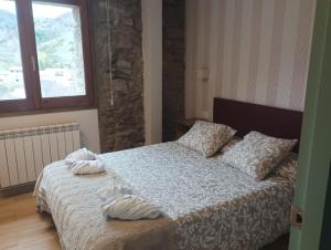 Postel nebo postele na pokoji v ubytování Cal Xesc