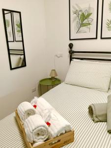 a bedroom with a bed with towels on it at Lake Como PORTO VECCHIO in Domaso +45 photos