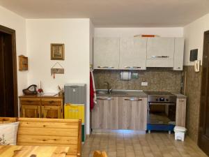 Kuchyň nebo kuchyňský kout v ubytování Appartamento Le Marmotte - Auronzo