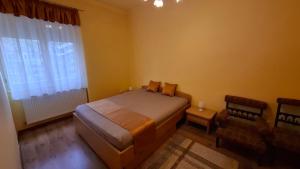 Postel nebo postele na pokoji v ubytování Piac Kuckó Apartman