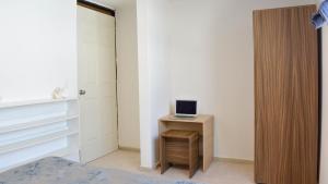 TV a/nebo společenská místnost v ubytování Casa Talento hostal hotel coliving