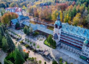 an aerial view of a large building with a tower at Apartment Step-Free in Świeradów-Zdrój