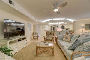 a living room with a couch and a table at Pine Cove 204 in Sanibel