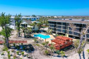 an aerial view of a resort with a pool and a building at Pine Cove 403C in Sanibel