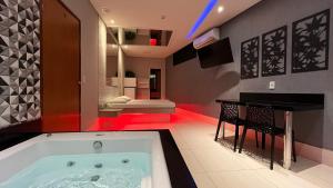 En eller flere senge i et værelse på Drops Motel Goiânia