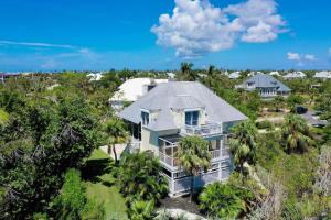 an aerial view of a house with palm trees at Gone Coastal in Sanibel