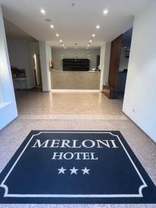a hotel lobby with a meridian hotel sign on the floor at Hotel Merloni in Grandola ed Uniti +45 photos