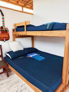 Postel nebo postele na pokoji v ubytování Cabaña Alojamiento Valhalla