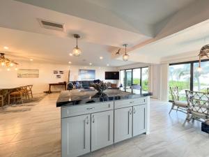 an open kitchen and living room with a dining room at Kings Crown 118 in Sanibel
