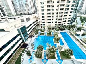 an aerial view of a building with a swimming pool at Golden Homes 29 blvd tower Urban nest 1BR Near Dubai mall & burj khalifa downtown dubai in Dubai