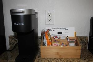 a box of food sitting next to a coffee machine at Coastal Serenity in St Pete Beach +37 photos