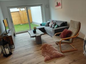 Posezení v ubytování Ferienwohnung zum Schneiderkramer