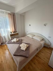 Ένα ή περισσότερα κρεβάτια σε δωμάτιο στο KRUM Apartments