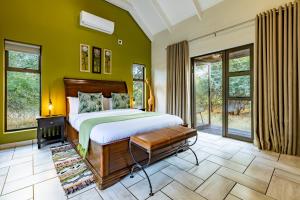 Ένα ή περισσότερα κρεβάτια σε δωμάτιο στο Wildheart Safari - MAIN