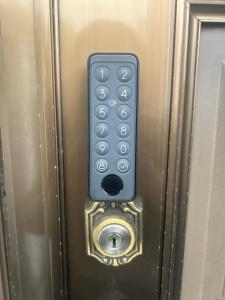a remote control on the door of a elevator at 池袋House3F Cozy for 1-3 guests in Tokyo