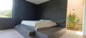 Postel nebo postele na pokoji v ubytování Totumo Casa Hotel