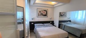 Posteľ alebo postele v izbe v ubytovaní Appartamento incantevole con parcheggio gratuito