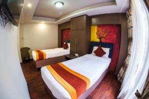 Rúm í herbergi á Hotel Kathmandu square
