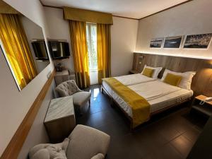 Postel nebo postele na pokoji v ubytování Hotel Cortese